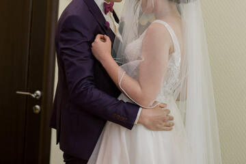 bride and groom hugging in the room