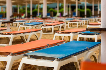 Fototapeta na wymiar Empty sun loungers on the beach. No tourists.
