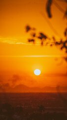 beautiful sunset with cloudy skies over the city and mountains 