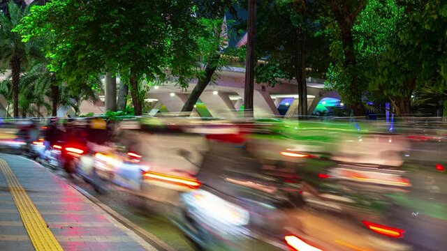jakarta city night time illuminated famous busy moto traffic street side timelapse panorama 4k indonesia