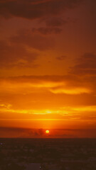 beautiful sunset with cloudy skies over the city and mountains 