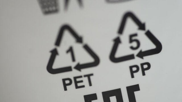 Closeup view of signs and symbols of recycling on white background packaging spbd. Eco labeling pet and PP is depicted on packages of products made of polypropylene. Concept: recycling, ecology