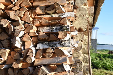 Wood burning stove. Firewood for furnace heating. Warehouse for firewood for stove
