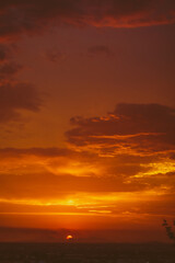 Fototapeta premium beautiful sunset with cloudy skies over the city and mountains 