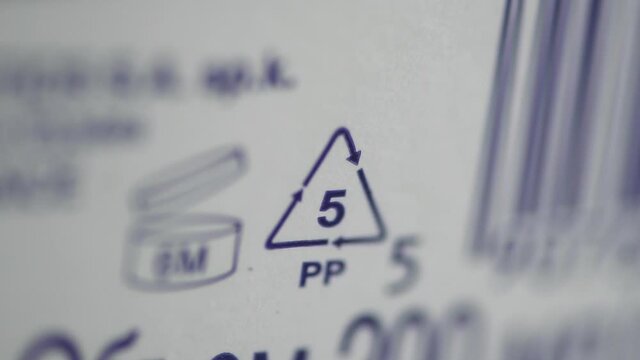 Closeup view of eco-labeling and other signs depicted on white background packaging spbd. Special mark on product guarantees environmental safety of entire production life cycle - from raw materials