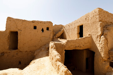 Abandoned houses in the traditional construction of Arabic adobe architecture in Qusur al Muqbil...