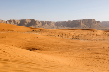 Red sand dunes called Red Sands south of Riyadh. You can see the lanes of quads because the dunes...