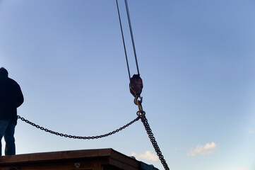 Fototapeta premium Lifting a house with crane