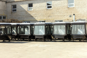 Tractors and cab harvesters. Agricultural machinery at the assembly plant