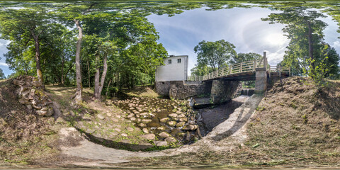 full seamless spherical hdri panorama 360 degrees angle view near damm among the bushes and trees...
