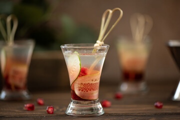 alcoholic shot with vodka, lemon juice and pomegranate