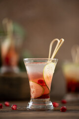 alcoholic shot with vodka, lemon juice and pomegranate