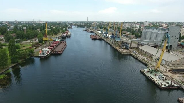 Aerial shot of Dnipro tributory full of barges and boats on a sunny day in summer