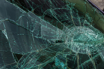 Selective focus image on the broken windshield of the car. Car accident. Broken windshield of a car...