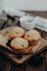 The tasty muffins with chocolate on a wooden desk. Muffins for perfect and beautiful breakfast. 