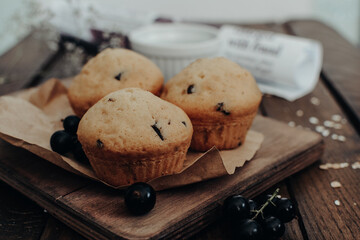 The tasty muffins with chocolate on a wooden desk. Muffins for perfect and beautiful breakfast. 