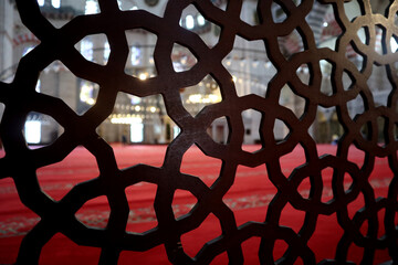 View into the interior of the S&uuml;leymaniye Mosque in Istanbul, with domes, prayer room, windows and numerous calligraphies.