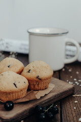 The tasty muffins with chocolate on a wooden desk. Muffins for perfect and beautiful breakfast. 