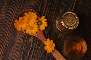 Calendula aromatherapy. Essential oil and  Calendula Flowers