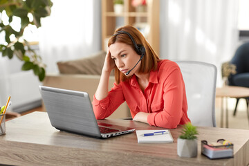 remote job, technology and people concept - sad young woman with headset and laptop computer having video conference at home office