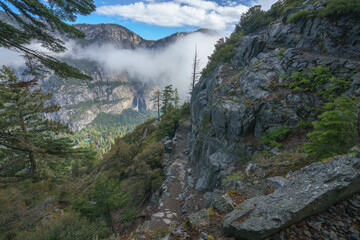 hiking the four mile trail in yosemite national park in california, usa
