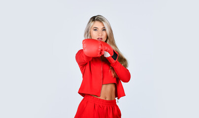 Sport is our life. beautiful woman with red boxing gloves. young sports woman in tracksuit and boxing gloves. blond boxer woman. kick off. confident young sportswoman posing in boxing gloves