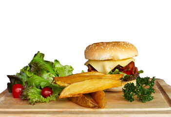 Hamburger and fries on a wooden tray