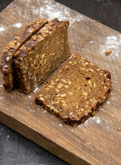 Fitness bread with seeds lies on a wooden Board.