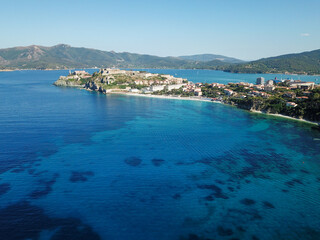 Drone view of Elba island northern coastline. Portoferraio and its white cliffs beaches. Capo Bianco. Italy	