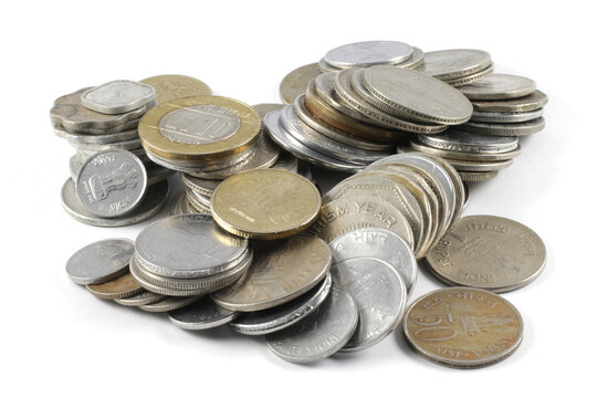 Currency coins of rupees five, rupee one, rupees two and more. Image depicting currency, expenses savings and investments.