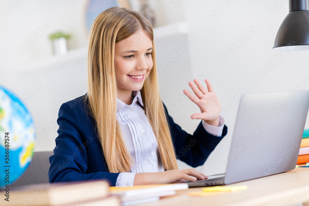 Canvas Prints Close-up profile side view portrait of her she nice attractive pretty cheerful small little long-haired girl attending web conference waving hi in light white class room indoors