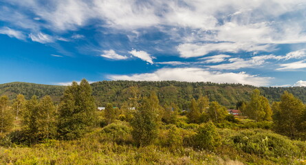 Summer  landscape with hills, sky, forest