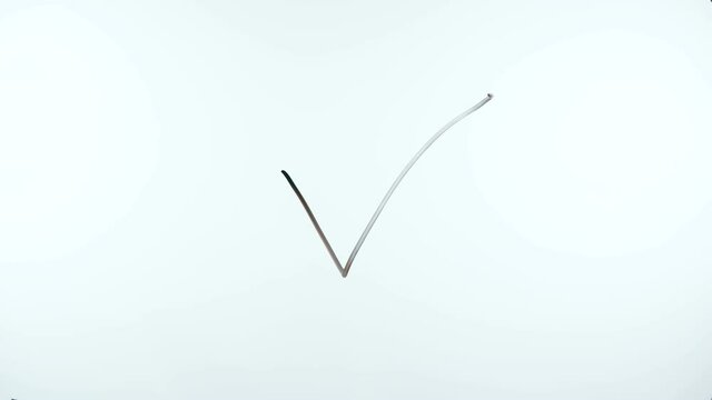 Video of man drawing tick and cross