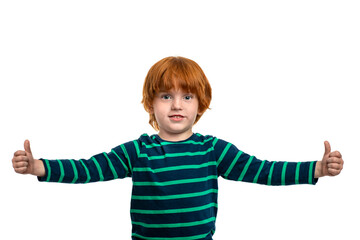 Redhead little boy  cives you an approving gesture, isolated