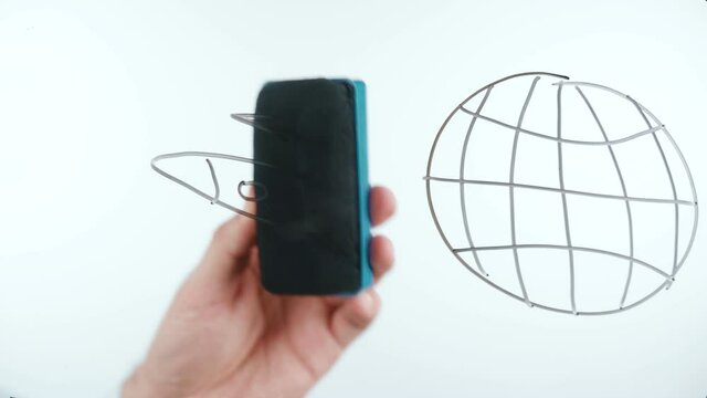 Shooting of man drawing planet with rocket