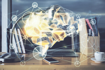 Multi exposure of work table with computer and brain hologram. Brainstorm concept.