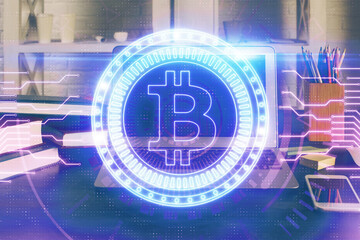 Multi exposure of blockchain theme hologram and table with computer background. Concept of bitcoin crypto currency.