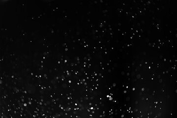 White dust on a black background