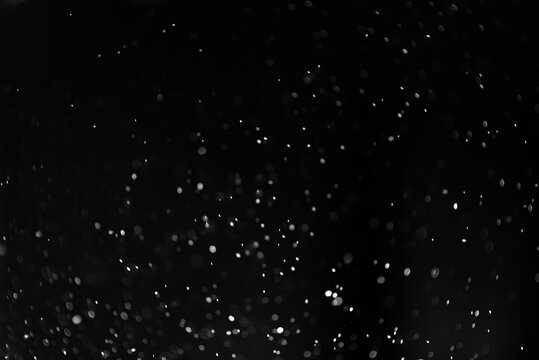 White dust on a black background