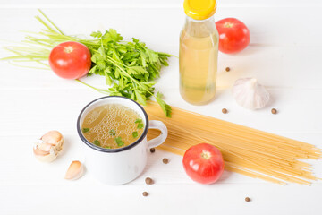 vegetable broth, vegan menu, broth and ingredients for vegetarian soup.