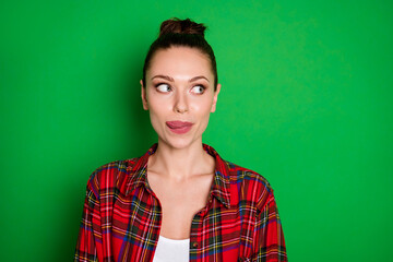 Fototapeta premium Close-up portrait of her she nice attractive pretty lovely cheery dreamy girl in checked shirt licking lip anticipating good tasty food isolated on bright vivid shine vibrant green color background