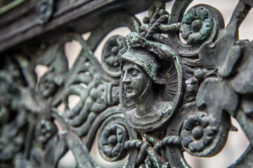 Bronze high reliefs on the fence of the Duomo in the city of Bergamo. Lombardy, Italy