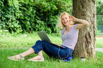 Nature is essential to wellbeing and ability to be productive and high functioning at work. Reasons why you should take your work outside. Work in summer park. Girl work with laptop in park