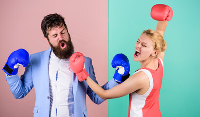 Man and woman boxing fight. Couple in love competing in boxing. Conflict concept. Family quarrel. Boxers fighting in gloves. Domination concept. Gender battle. Gender equal rights. Gender equality