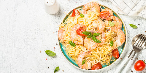 Pasta seafood with shrimp on white table.