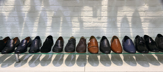 shoes on the shelf in the store, men's shoes are new