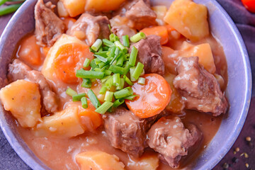 Bowl with tasty beef stew, closeup