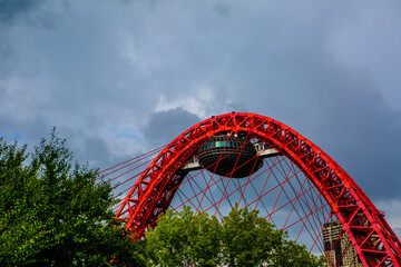 Red bridge on a cloud background