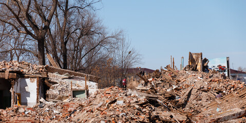 Chapaevsk, Russia-April, 11, 2018: people disassemble the ruins of collapsed houses after the elements, debris analysis