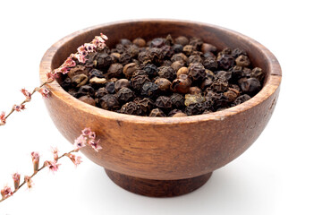 Thyme grains in white background and wooden presentation bowl